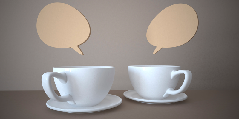 Dos tazas de té con globos de diálogo encima
